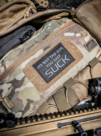 "IT'S NOT THE GUN YOU JUST SUCK" PATCH